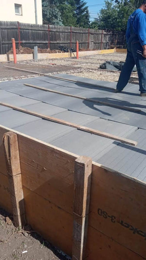 Placing Steel Plates at Ground Level for a Single-Story House Under Construction thumbnail