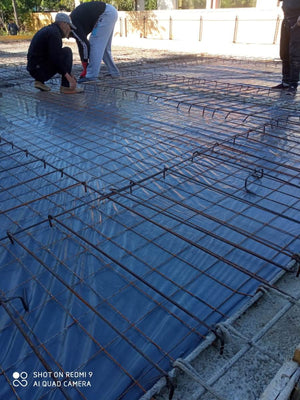 Placing Steel Plates at Ground Level for a Single-Story House Under Construction thumbnail