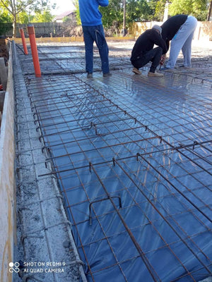Placing Steel Plates at Ground Level for a Single-Story House Under Construction thumbnail