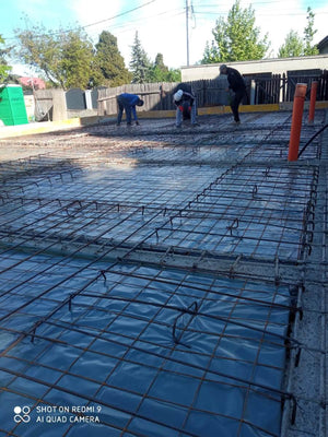 Placing Steel Plates at Ground Level for a Single-Story House Under Construction thumbnail