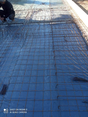 Placing Steel Plates at Ground Level for a Single-Story House Under Construction thumbnail