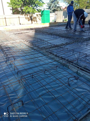 Placing Steel Plates at Ground Level for a Single-Story House Under Construction thumbnail