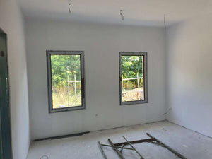 Sanding, Preparation, and Primer Application for a Ground Floor Metal House thumbnail