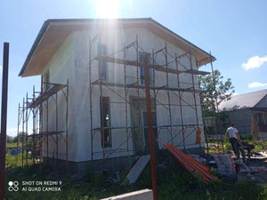 Primer Layer Applied to the Facades of a Metal House under Construction thumbnail
